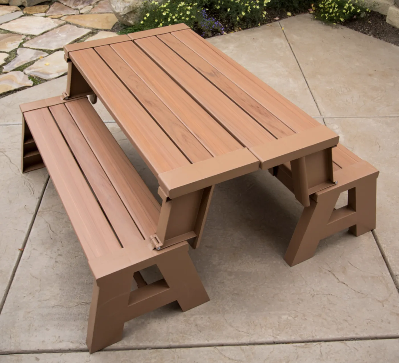 The same bench folded open into a picnic table